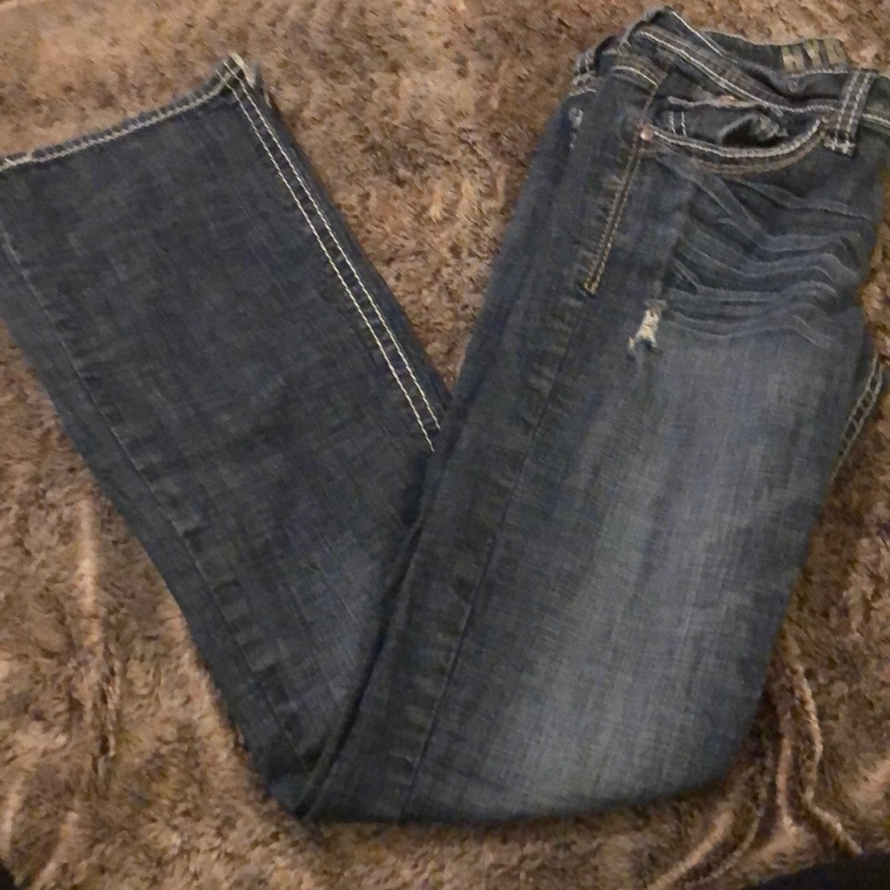 Distressed dark wash jeans